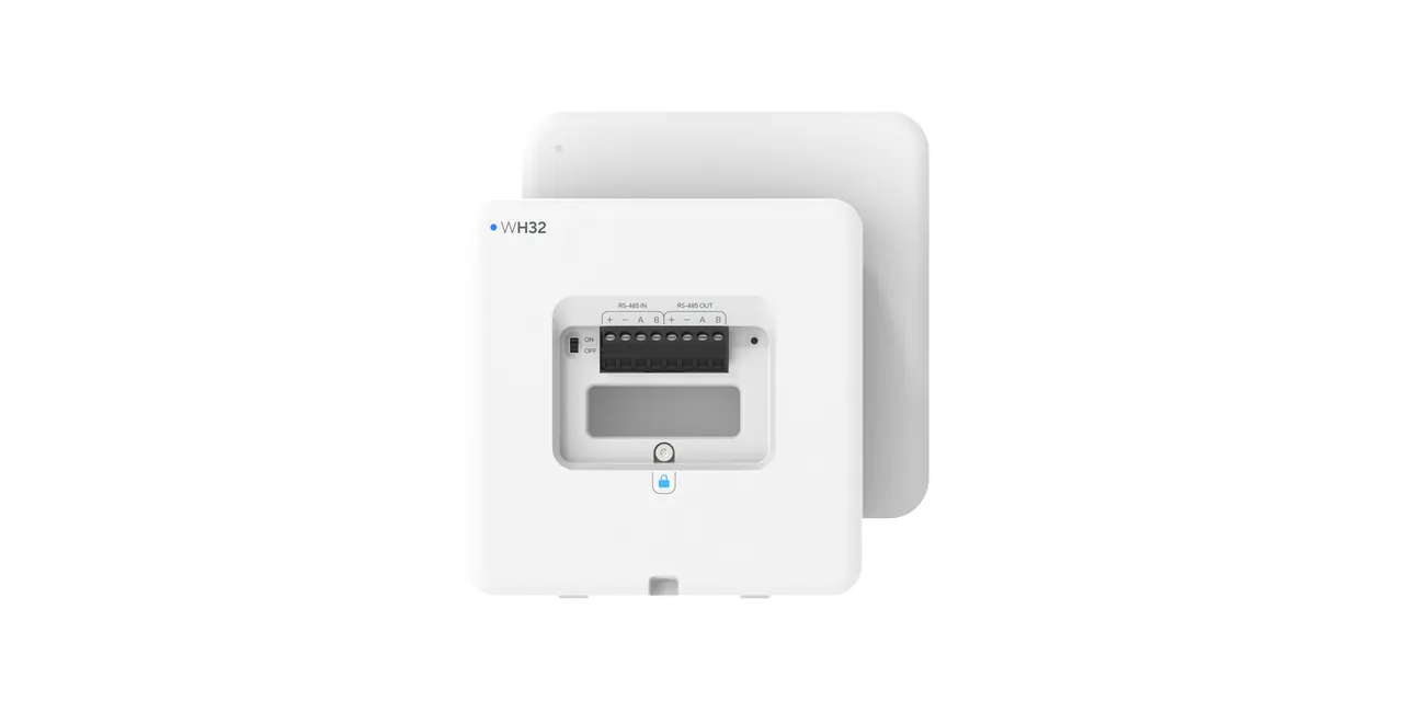Smoke detector mounted on a commercial ceiling with status indicator