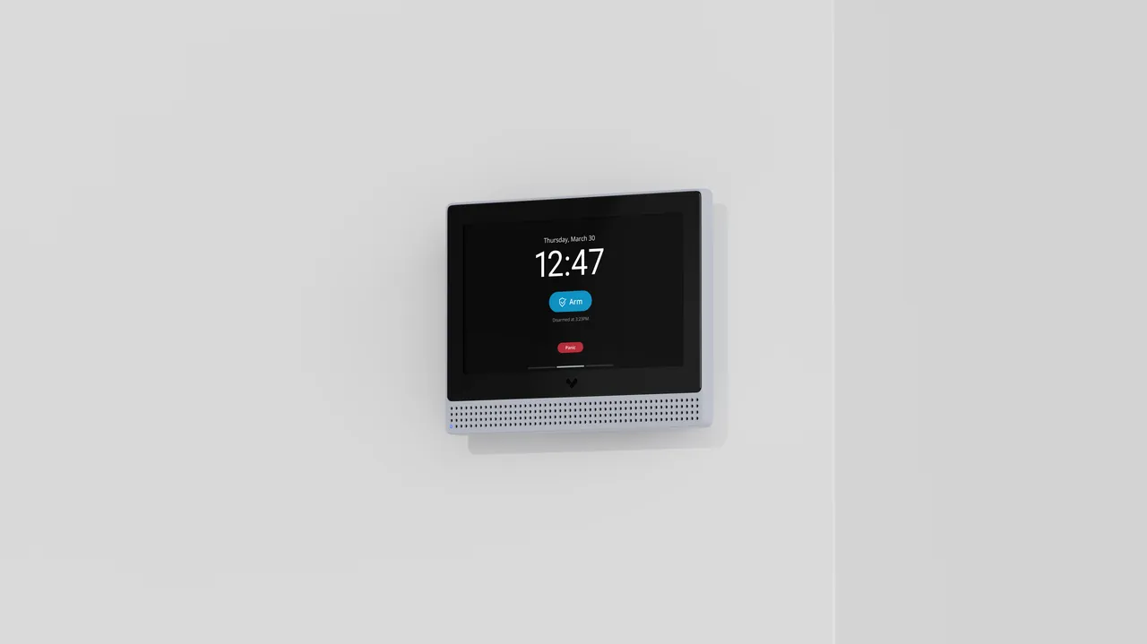 Verkada alarm keypad mounted on a white wall displaying the time 12:47.