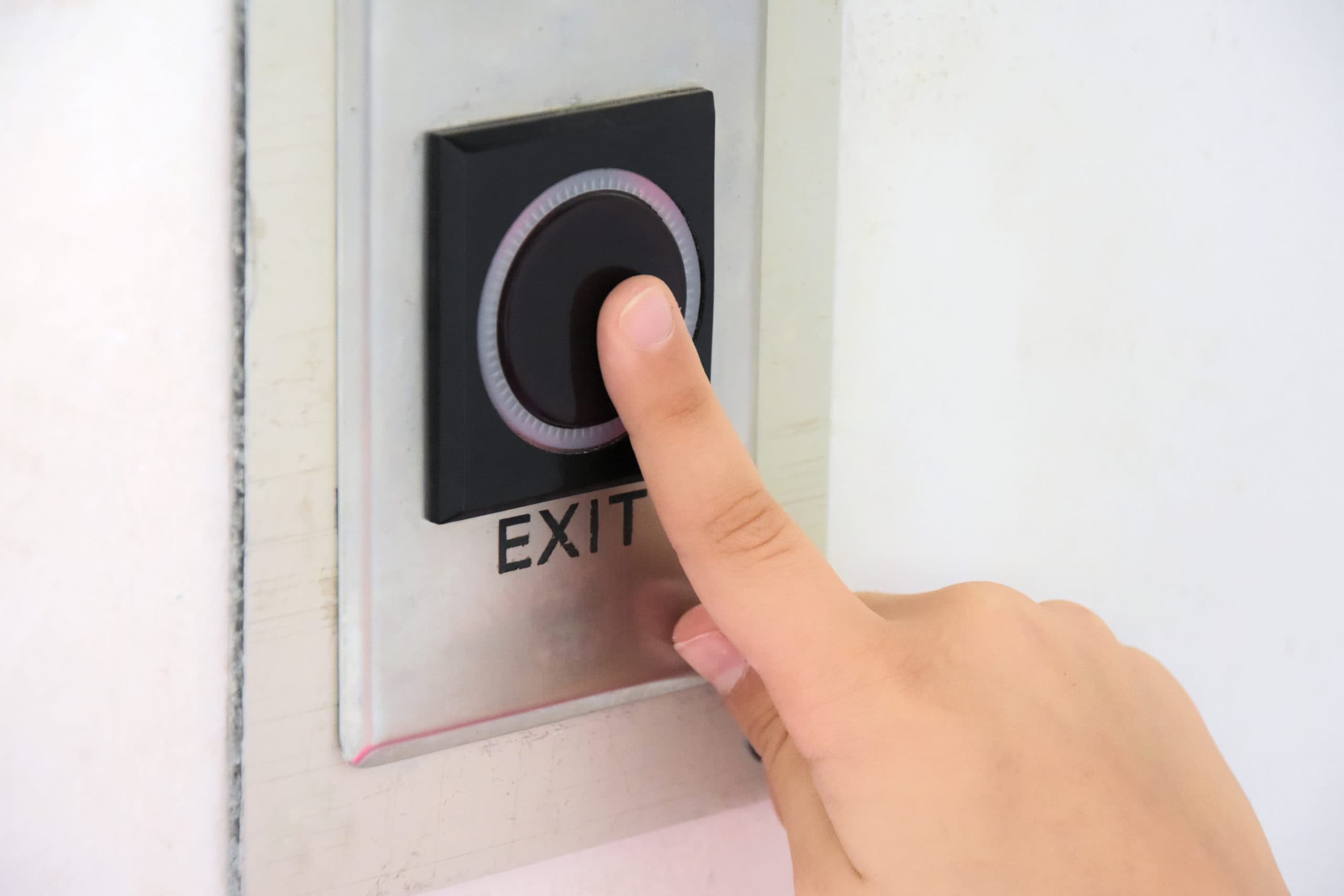 This is a persons finger using a push to exit button