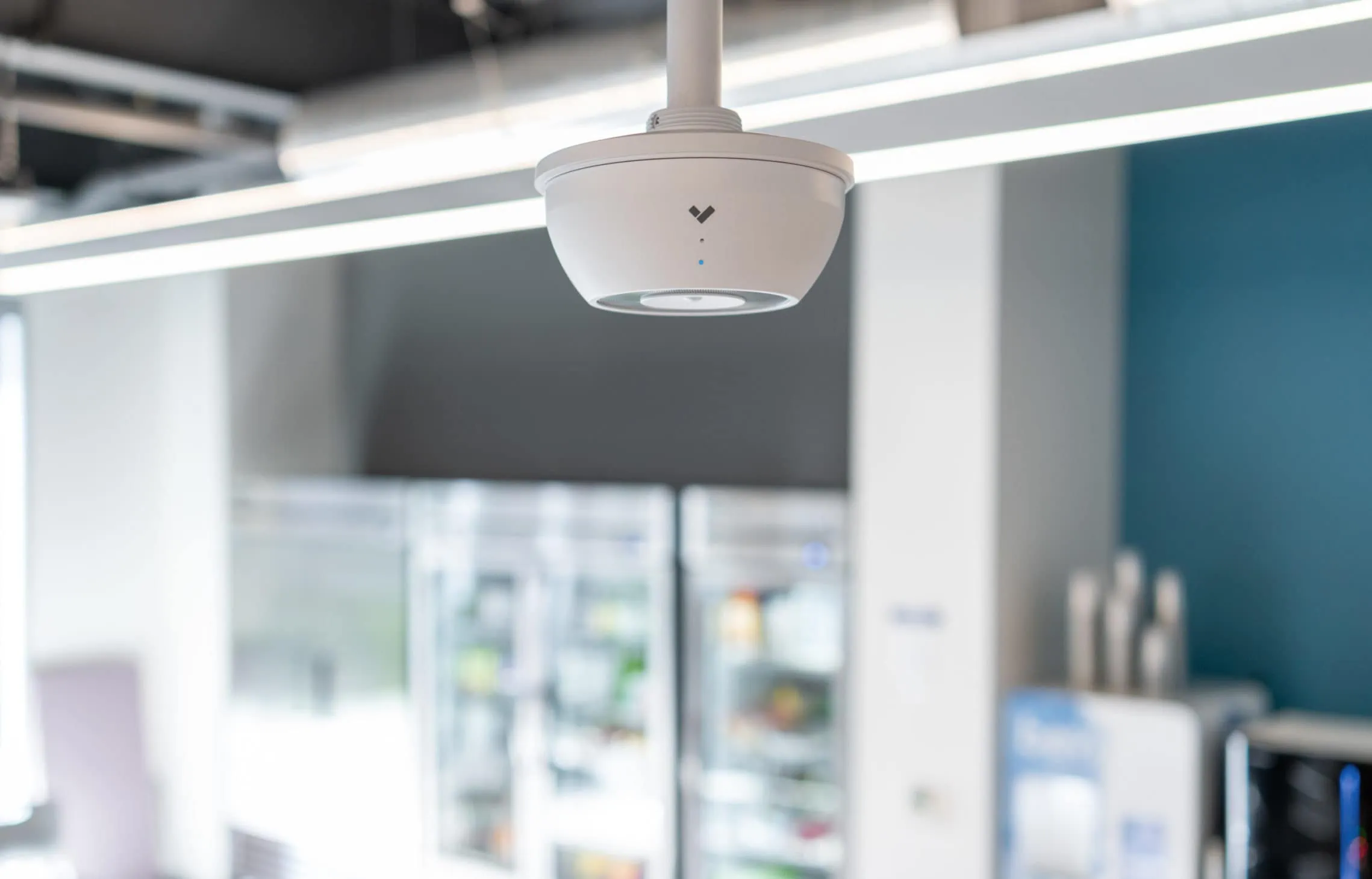 The highly-rated and -reviewed SV11 Environmental Sensor mounted on the ceiling of a small business 