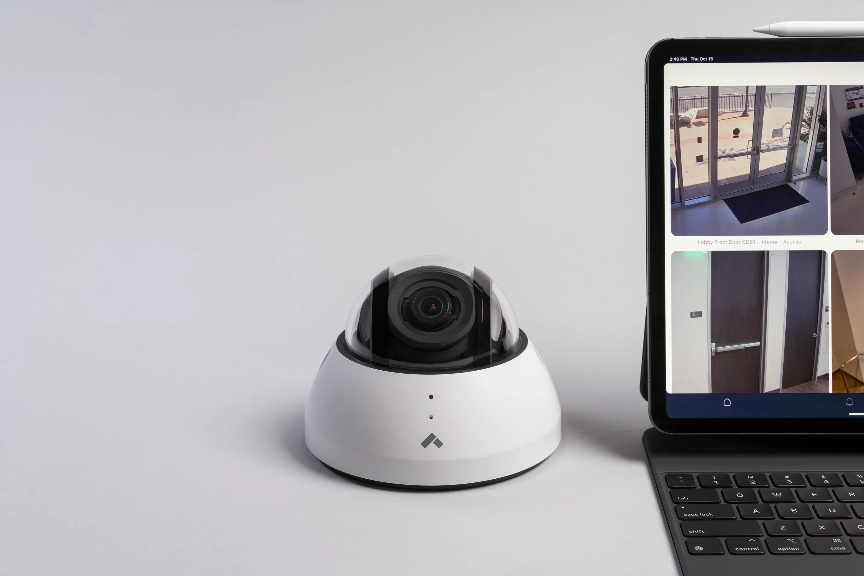 Verkada dome camera alongside laptop showing Command interface for construction security