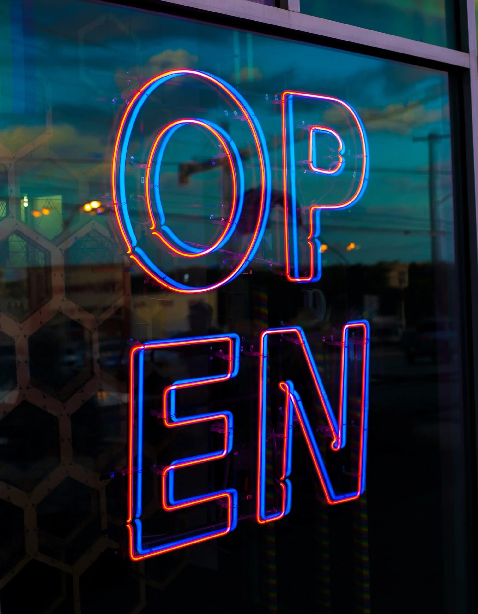 Open business sign on a Midland, TX restaurant that has security cameras for enhanced surveillance