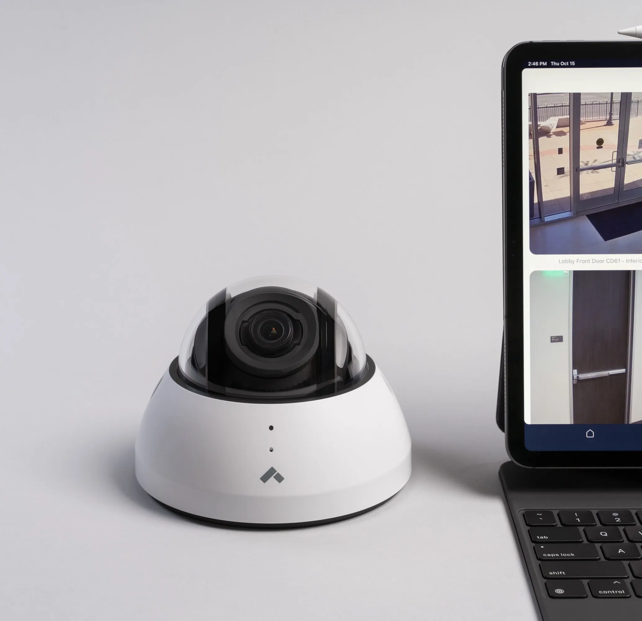 Verkada dome camera next to laptop displaying footage from security cameras Dallas