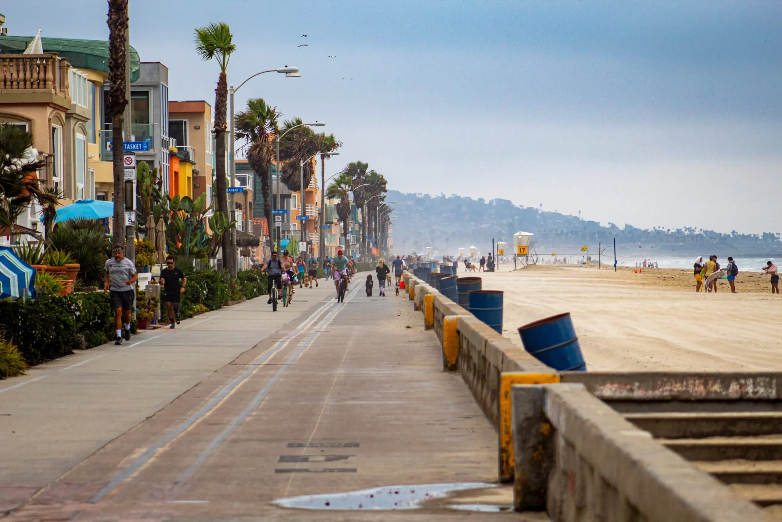 Boardwalk of San Diego beach with small businesses that are safeguard assets with security camera systems