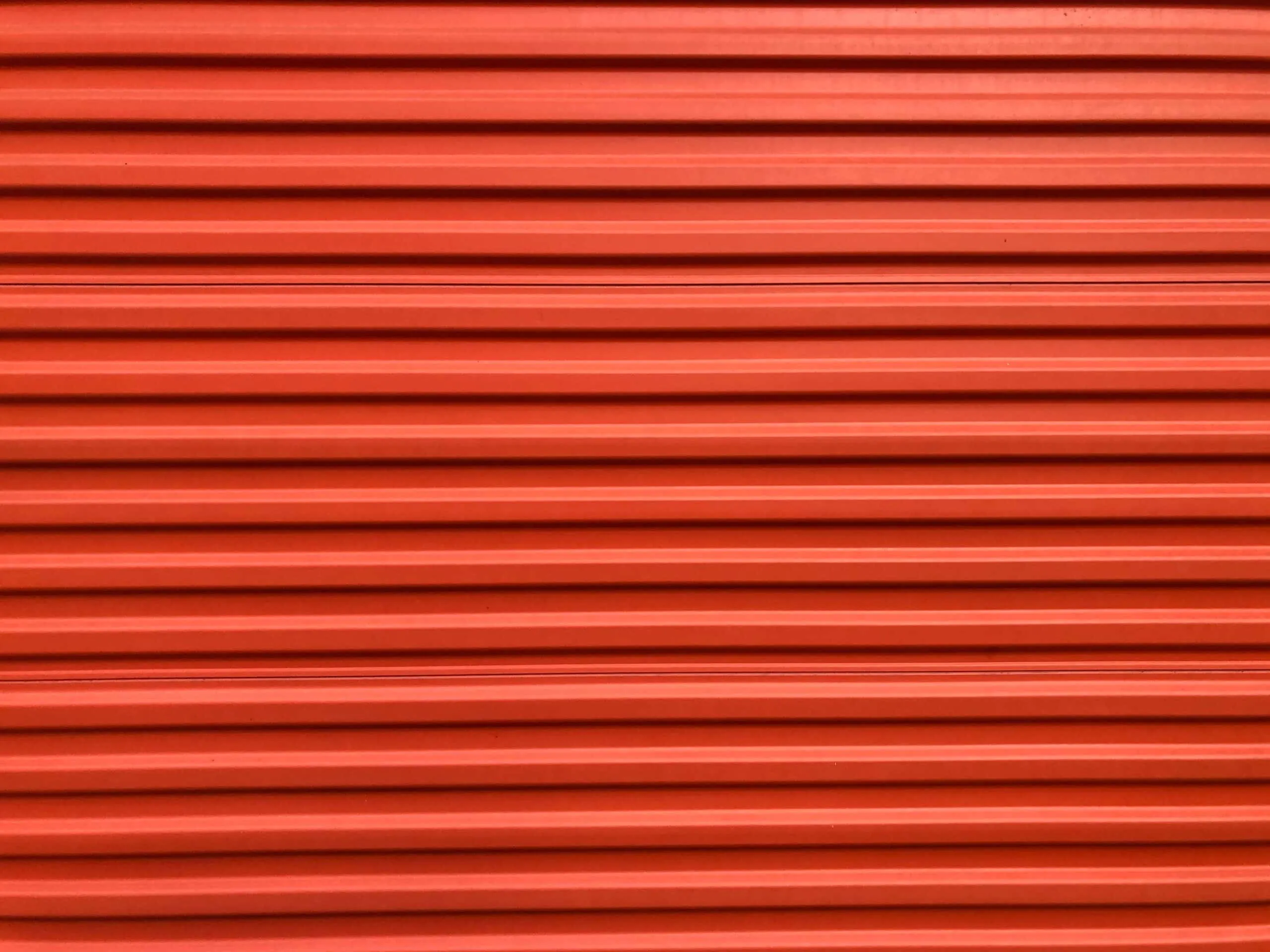 Roll-up steel sheet door of a self-storage unit that has a security camera system