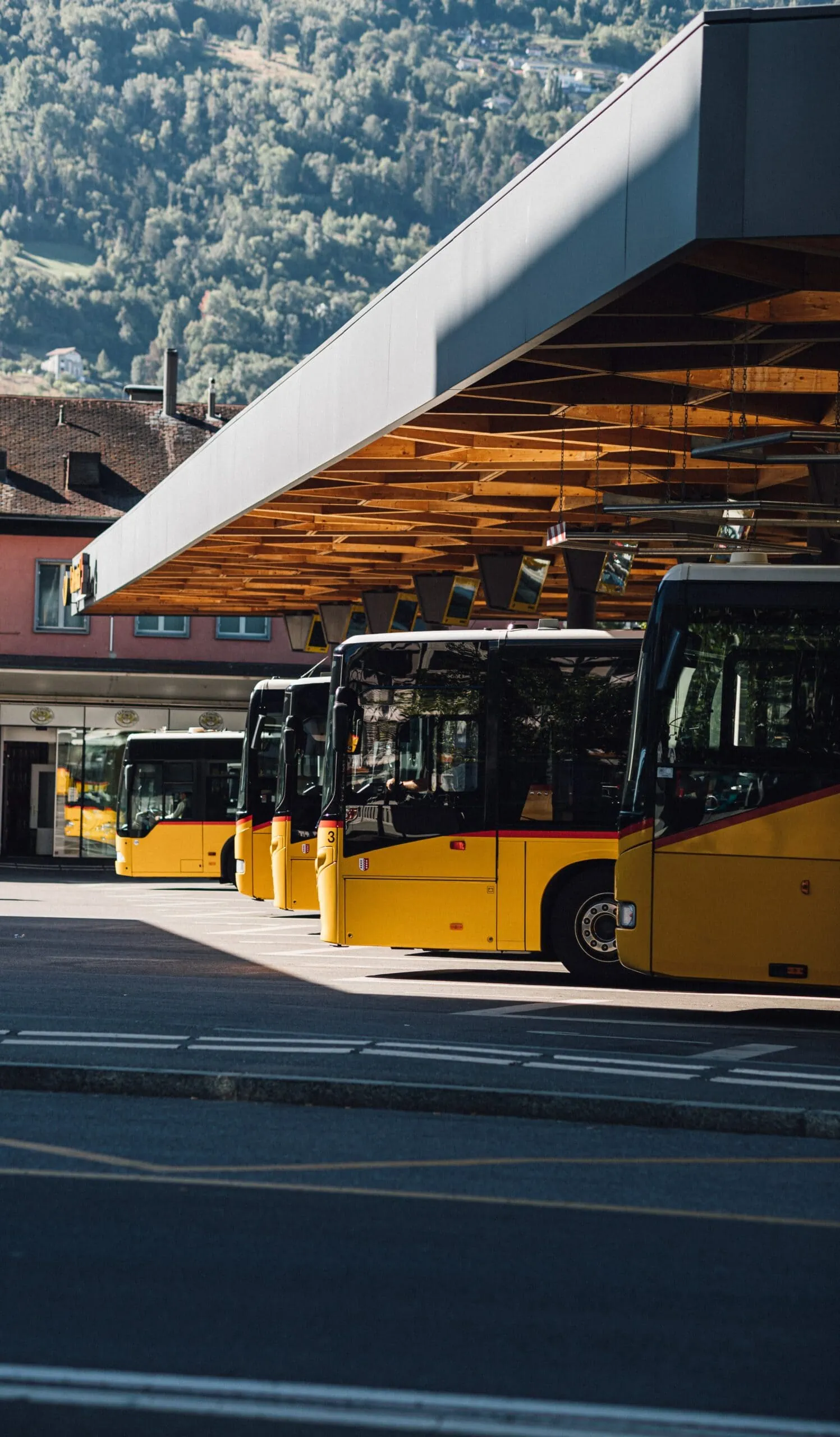 Buses in parking lot for a company that employs bus GPS trackers