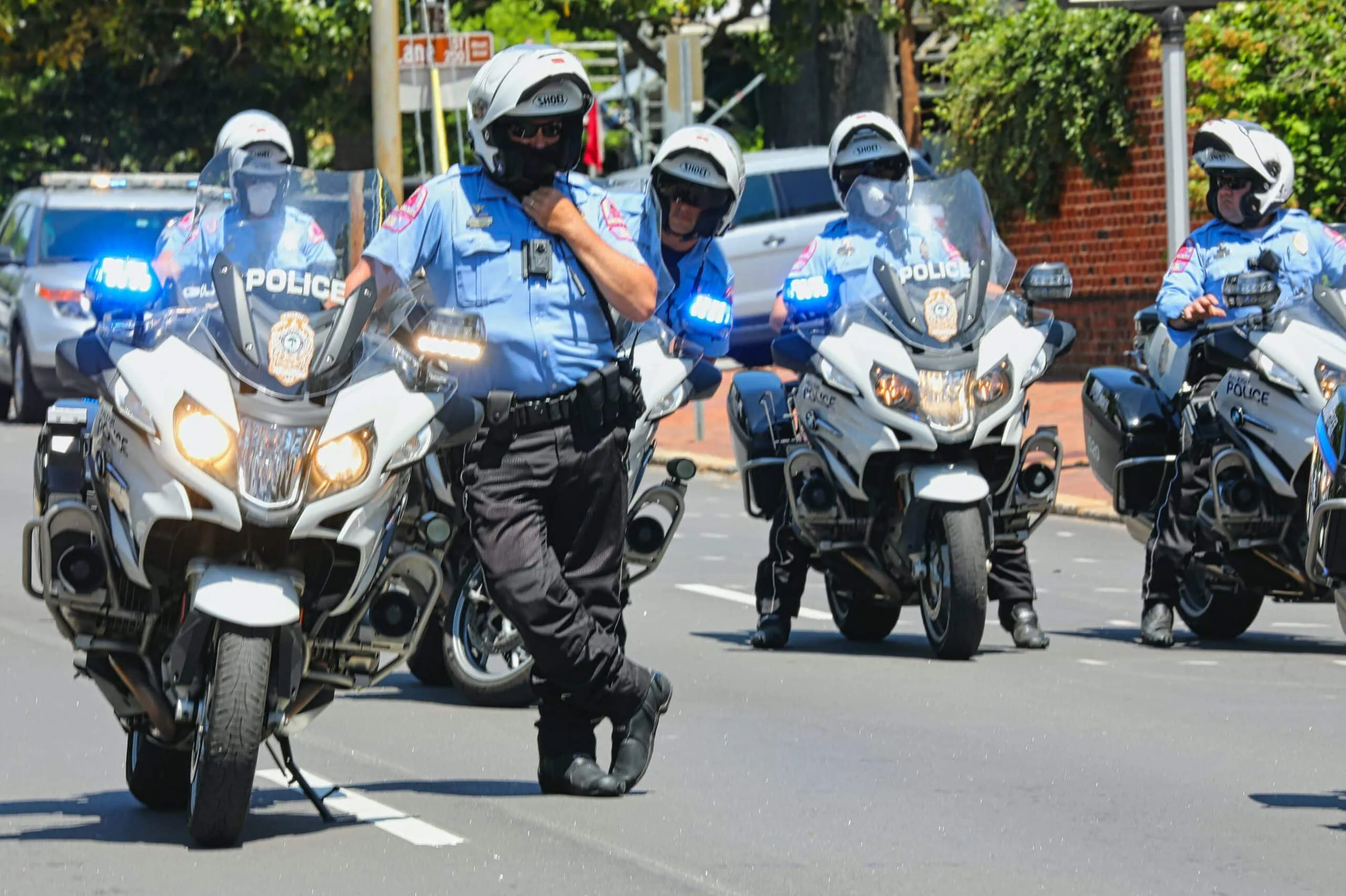 Police drivers on motorcycle following stolen fleet because it has a GPS-enabled dash cam