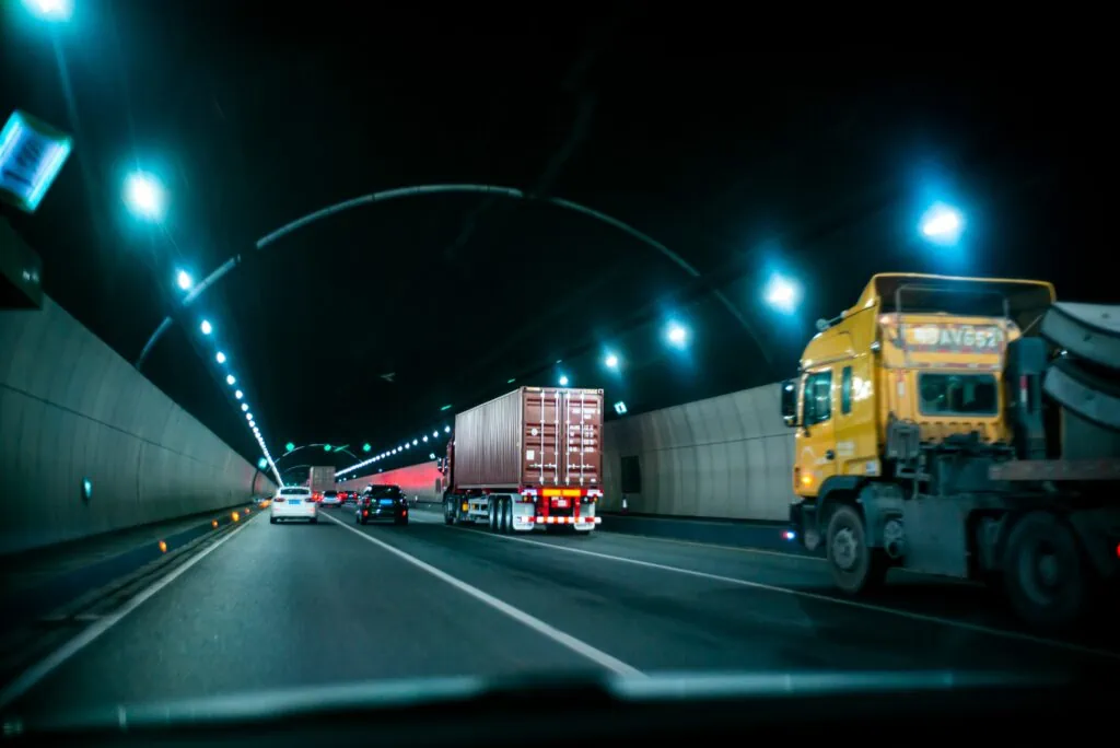 Tunnel with many semi trucks all protected by dash cameras