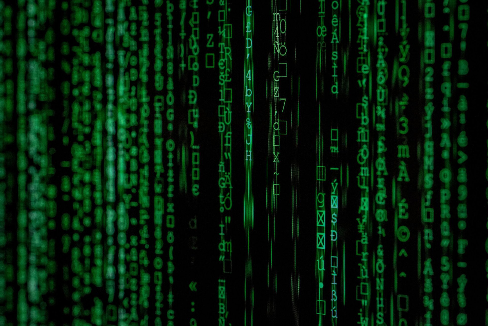 A close up of a green matrix code, symbolizing the encryption of NVR meaning.