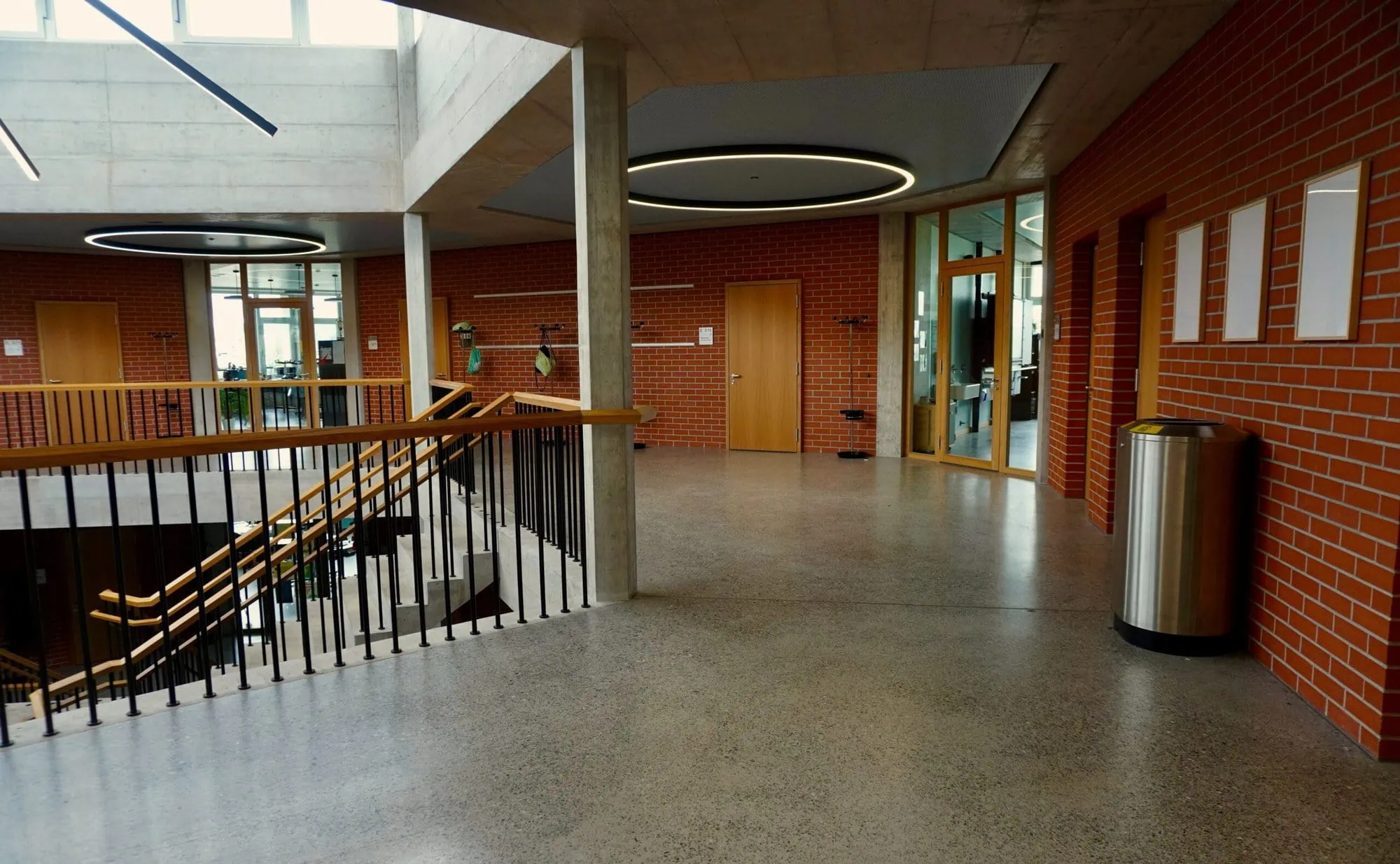 School hallway, nearby stairs and open classroom door, is protected by security cameras with best video quality